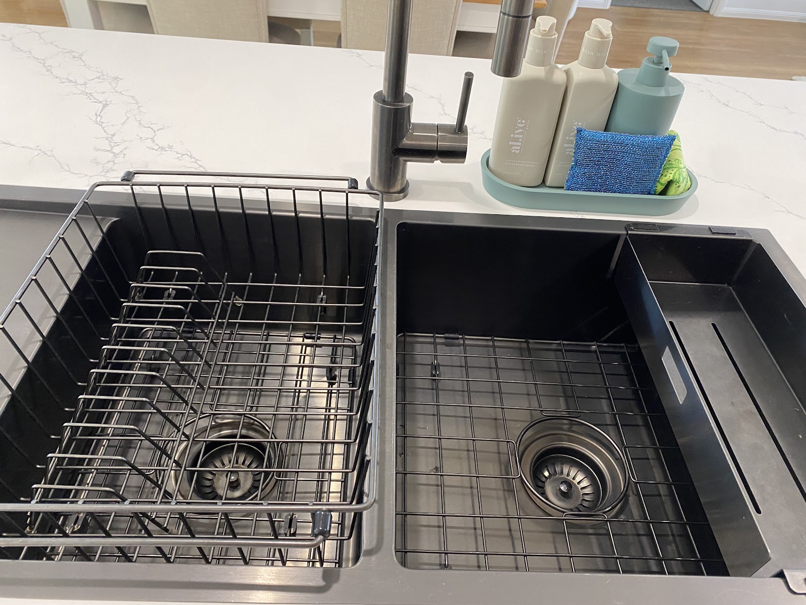 Black double kitchen sink with dish rack, clean and dry